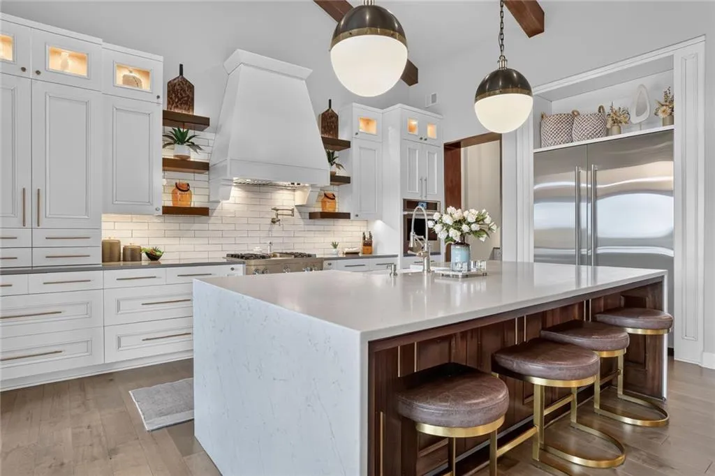 Striking Parkville Estate with a Floating Staircase and Fire-and-Water Pool Asks $3,550,000 14 8085 NW Green Glades Ct Parkville MO 6415282