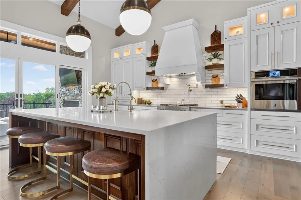 Striking Parkville Estate with a Floating Staircase and Fire-and-Water Pool Asks $3,550,000 15 8085 NW Green Glades Ct Parkville MO 6415283