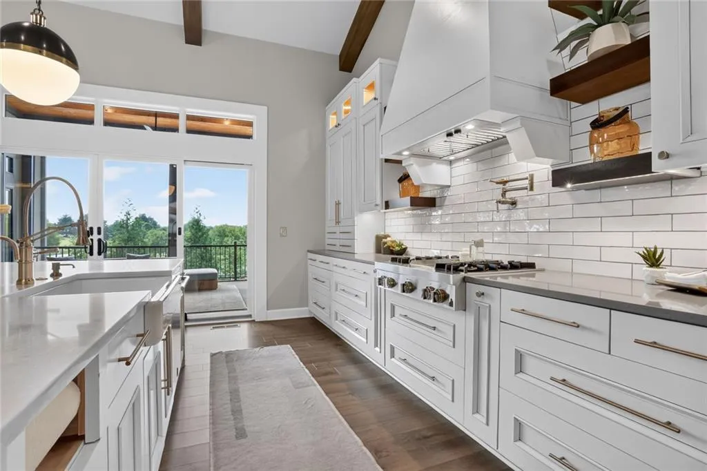 Striking Parkville Estate with a Floating Staircase and Fire-and-Water Pool Asks $3,550,000 16 8085 NW Green Glades Ct Parkville MO 6415286