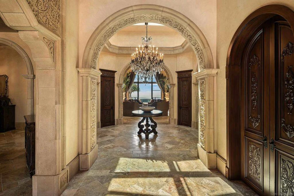 8619 Via Rancho Cielo – Arched Gallery 8619 Via Rancho Cielo, Rancho Santa Fe: an arched gallery connects richly detailed interior spaces.