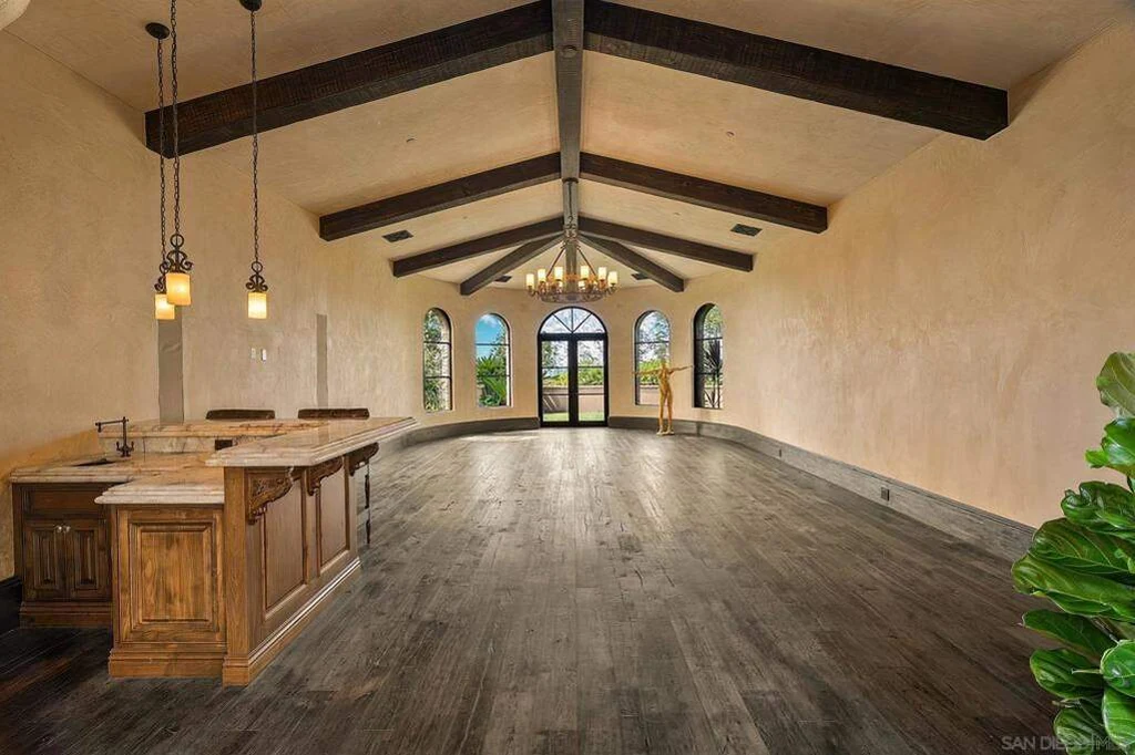 8619 Via Rancho Cielo – Ballroom 8619 Via Rancho Cielo, Rancho Santa Fe: a generous ballroom space includes exposed beams and a fitted bar.