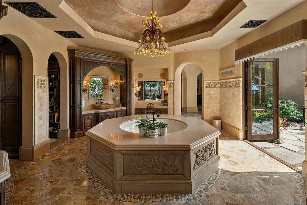 8619 Via Rancho Cielo – Primary Bathroom 8619 Via Rancho Cielo, Rancho Santa Fe: an octagonal bathtub anchors the richly detailed primary bathroom.