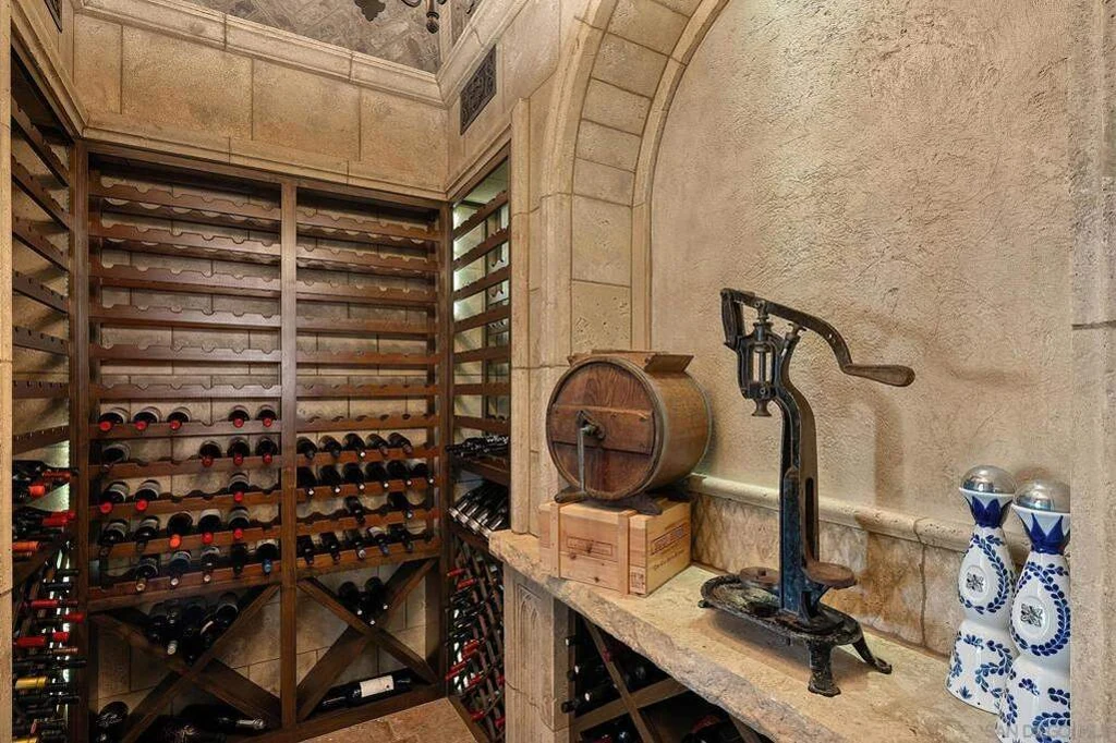 8619 Via Rancho Cielo – Wine Cellar 8619 Via Rancho Cielo, Rancho Santa Fe: wood racks and stone finishes give the wine cellar a distinctive character.